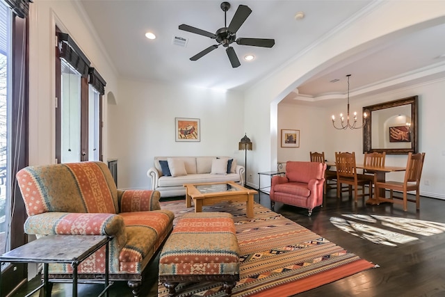 4303 Blossom St, Houston, TX 77007 - living area featuring crown molding, arched walkways, ceiling fan, a chandelier, and wood finished floors