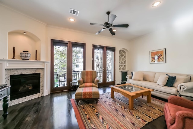 4303 Blossom St, Houston, TX 77007 - living area with crown molding, a premium fireplace, ceiling fan, dark wood finished floors, and recessed lighting