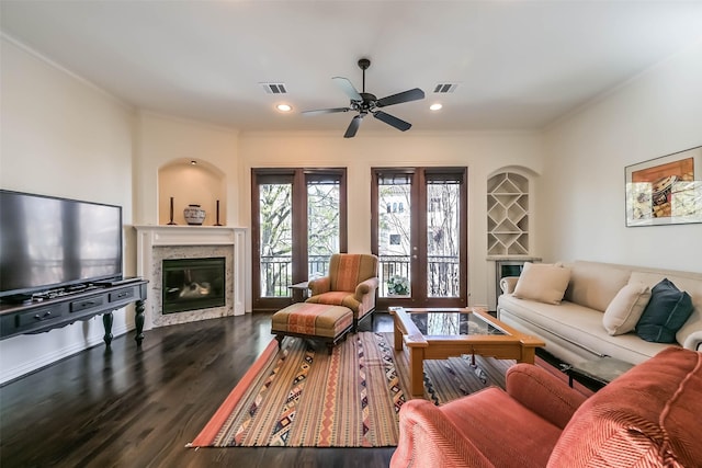 4303 Blossom St, Houston, TX 77007 - living area with a high end fireplace, ornamental molding, a ceiling fan, dark wood-style flooring, and recessed lighting