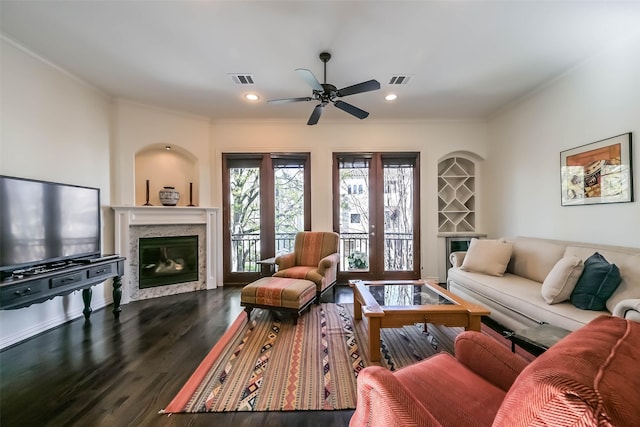 4303 Blossom St, Houston, TX 77007 - living area featuring a high end fireplace, crown molding, a ceiling fan, dark wood-style floors, and recessed lighting