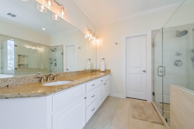 4303 Blossom St, Houston, TX 77007 - bathroom with double vanity, a shower stall, tile patterned flooring, baseboards, and ornamental molding