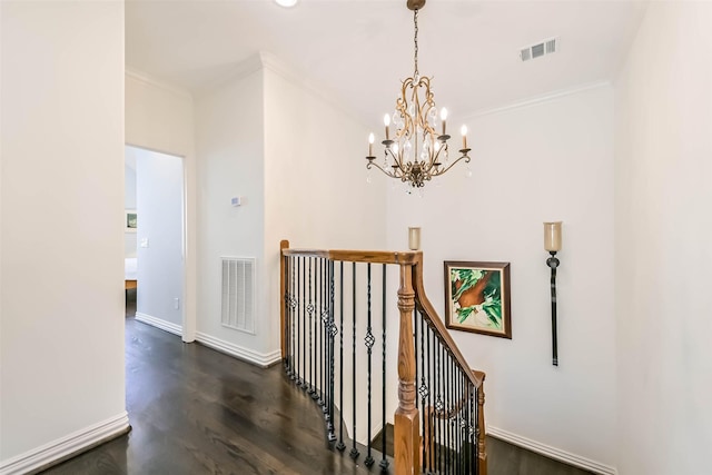 4303 Blossom St, Houston, TX 77007 - hall featuring an upstairs landing, ornamental molding, a chandelier, dark wood finished floors, and baseboards