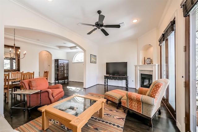 4303 Blossom St, Houston, TX 77007 - living area with arched walkways, ornamental molding, ceiling fan, a high end fireplace, and a chandelier