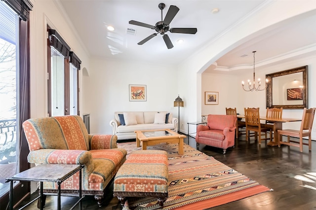 4303 Blossom St, Houston, TX 77007 - living area featuring arched walkways, a chandelier, ornamental molding, dark wood finished floors, and ceiling fan