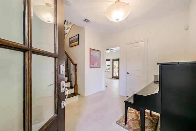 4303 Blossom St, Houston, TX 77007 - foyer featuring stairway, light flooring, and baseboards