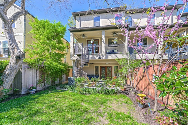 4303 Blossom St, Houston, TX 77007 - rear view of house featuring french doors, a ceiling fan, stairs, and stucco siding