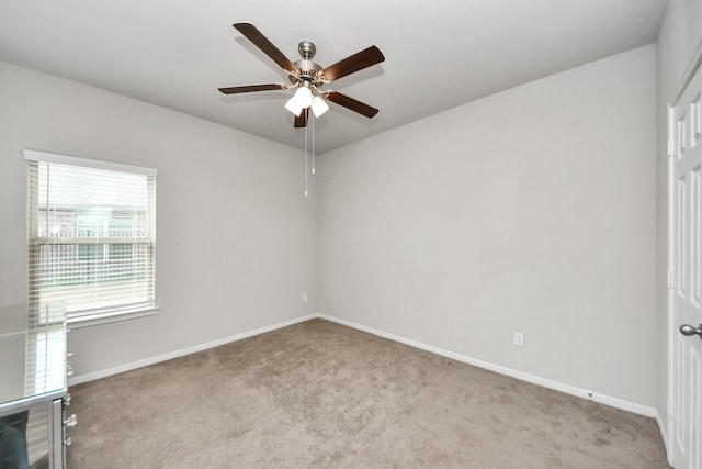 unfurnished room featuring baseboards, a ceiling fan, and carpet floors