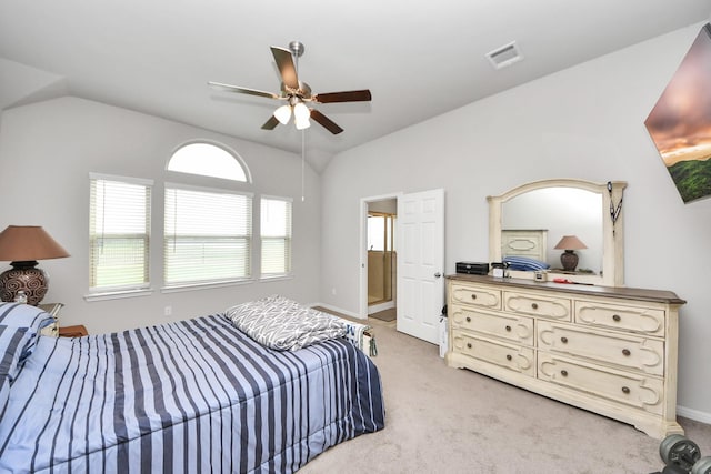 bedroom with visible vents, light carpet, baseboards, ceiling fan, and vaulted ceiling