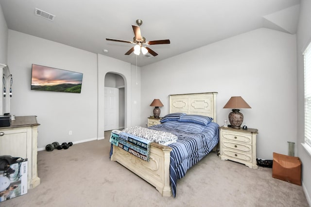 bedroom with visible vents, ceiling fan, baseboards, carpet, and arched walkways