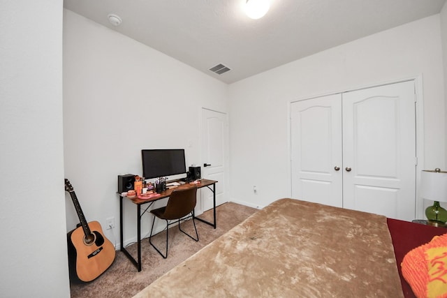 home office with carpet flooring and visible vents