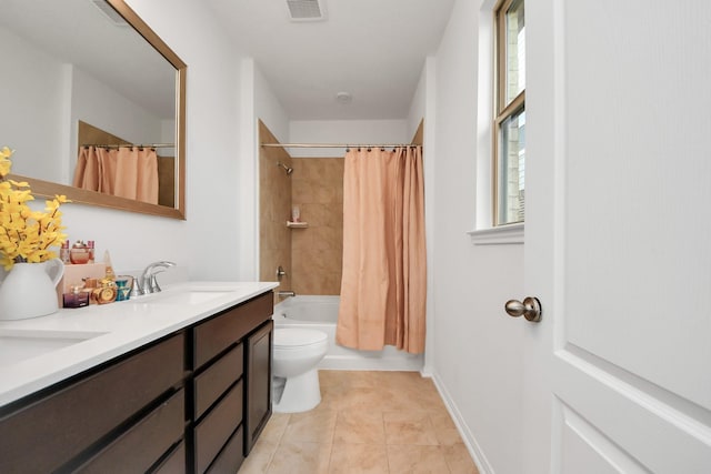 full bathroom with a sink, visible vents, double vanity, and tile patterned floors