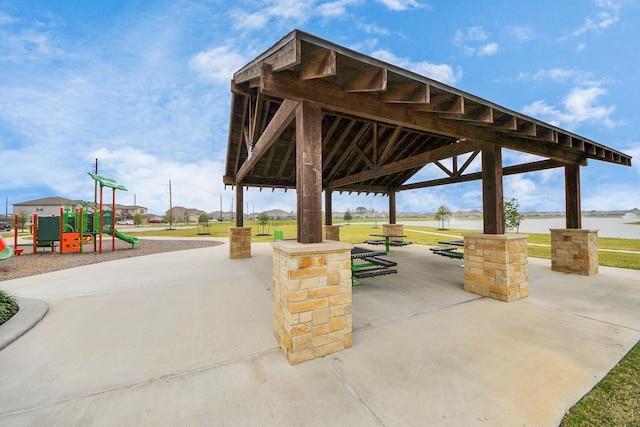 view of property's community with a gazebo, playground community, and a yard