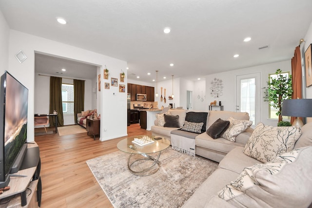 living area featuring recessed lighting and light wood-type flooring