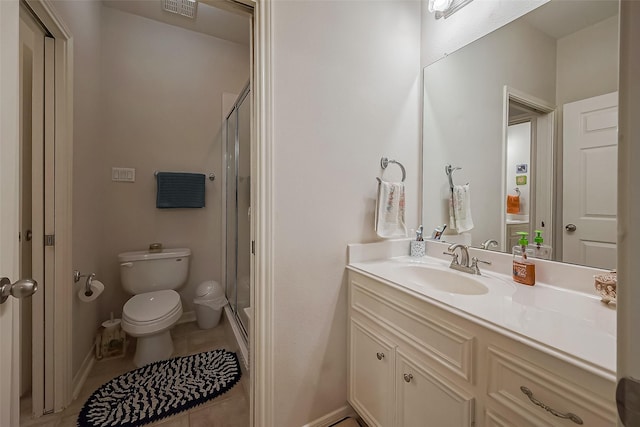 bathroom featuring vanity, toilet, a stall shower, and tile patterned flooring