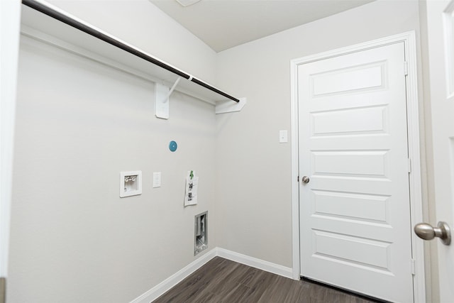 washroom featuring baseboards, dark wood-style flooring, hookup for a washing machine, and laundry area