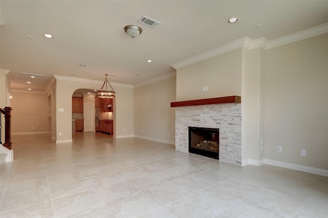 unfurnished living room featuring visible vents, ornamental molding, recessed lighting, arched walkways, and baseboards