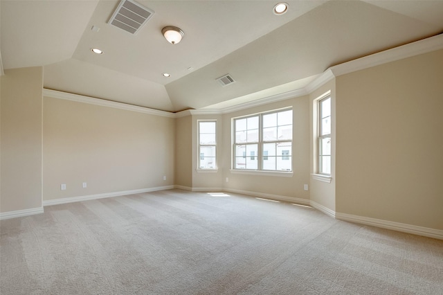 empty room with vaulted ceiling, visible vents, and ornamental molding