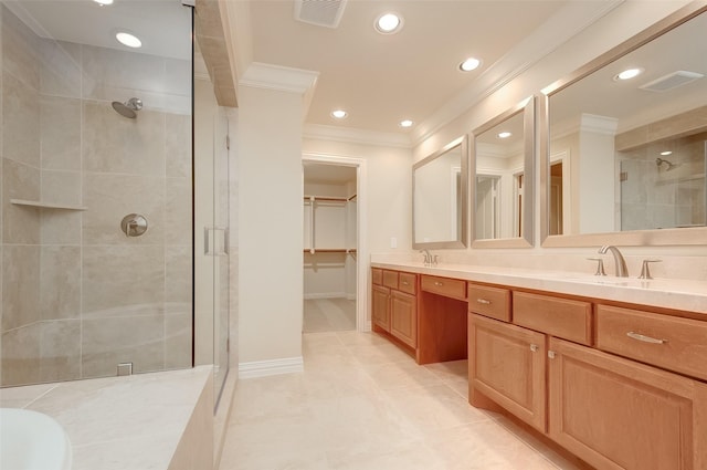 bathroom with a sink, visible vents, a shower stall, and crown molding