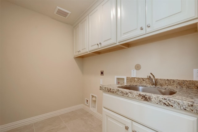 washroom with visible vents, washer hookup, a sink, cabinet space, and hookup for an electric dryer