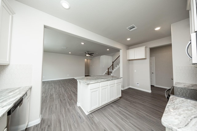 kitchen featuring baseboards, light wood finished floors, white cabinets, and appliances with stainless steel finishes