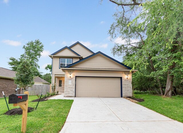 traditional home with brick siding, driveway, and an attached garage
