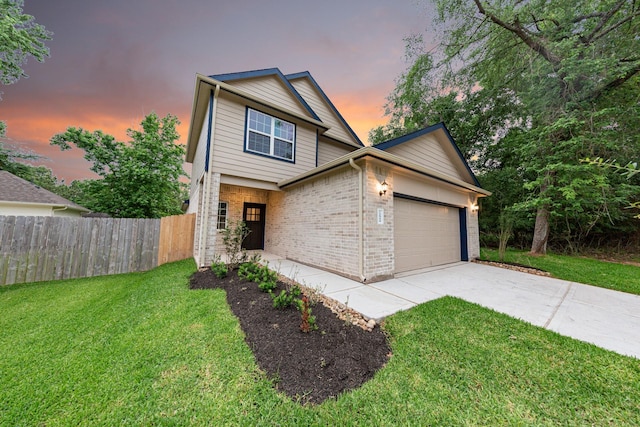 view of front of house with a garage, brick siding, and driveway
