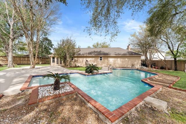 view of pool featuring a fenced in pool, a patio area, a fenced backyard, and french doors