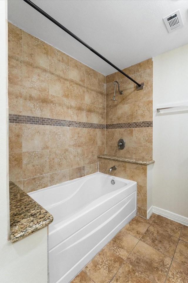 full bath with baseboards, shower / bath combination, and visible vents