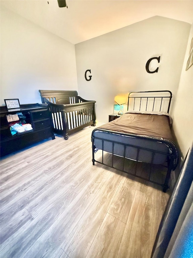 bedroom with wood finished floors