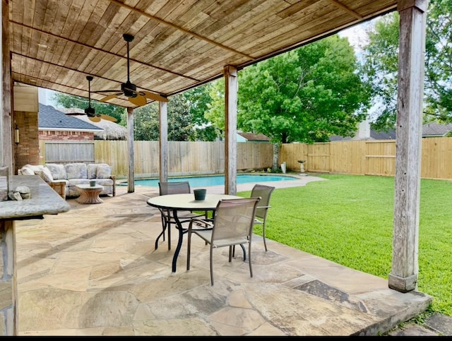 view of patio with an outdoor hangout area, a fenced in pool, a fenced backyard, and a ceiling fan