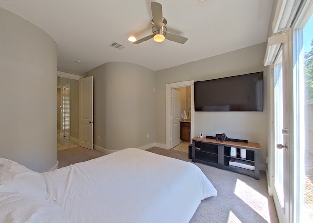 bedroom featuring a ceiling fan, baseboards, visible vents, light carpet, and connected bathroom