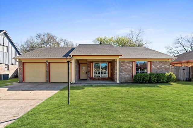 view of front of house with brick siding, a front yard, roof with shingles, a garage, and driveway