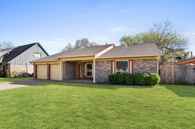 view of front of property featuring fence, driveway, a front lawn, a garage, and brick siding