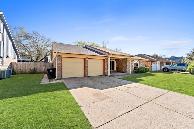 view of front of house with a front lawn, a garage, and brick siding