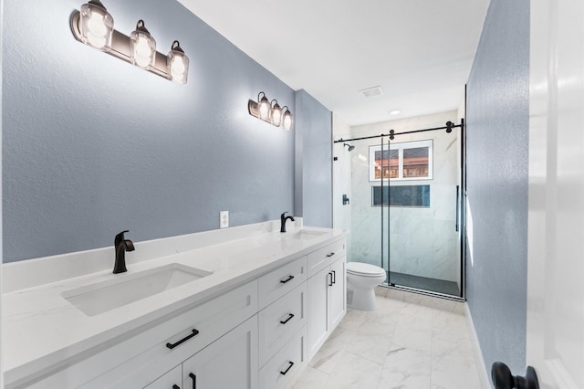 bathroom with a sink, a marble finish shower, toilet, and marble finish floor