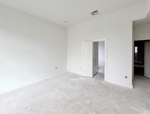 unfurnished bedroom with visible vents and baseboards