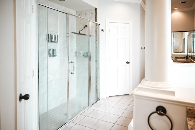 full bath with tile patterned flooring, a stall shower, and crown molding