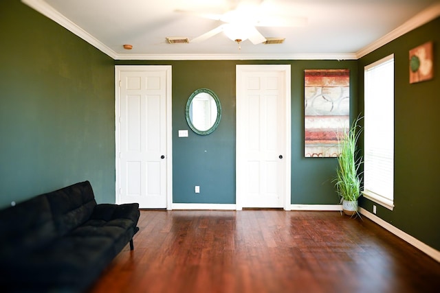 interior space with visible vents, baseboards, and wood finished floors