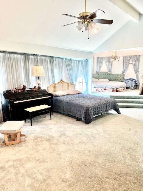 carpeted bedroom featuring lofted ceiling with beams and a ceiling fan