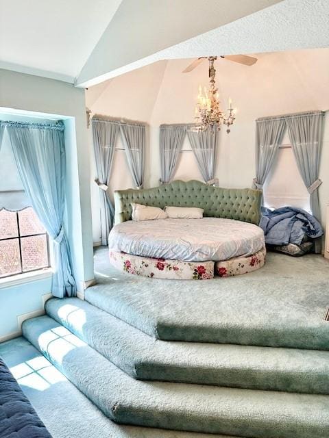 bedroom featuring carpet floors, a notable chandelier, and vaulted ceiling