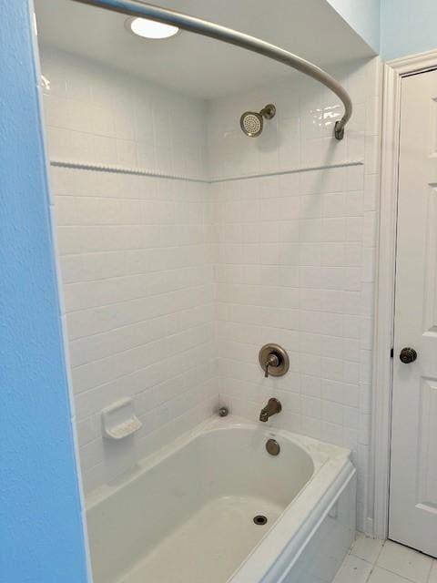 bathroom with tile patterned floors and tub / shower combination