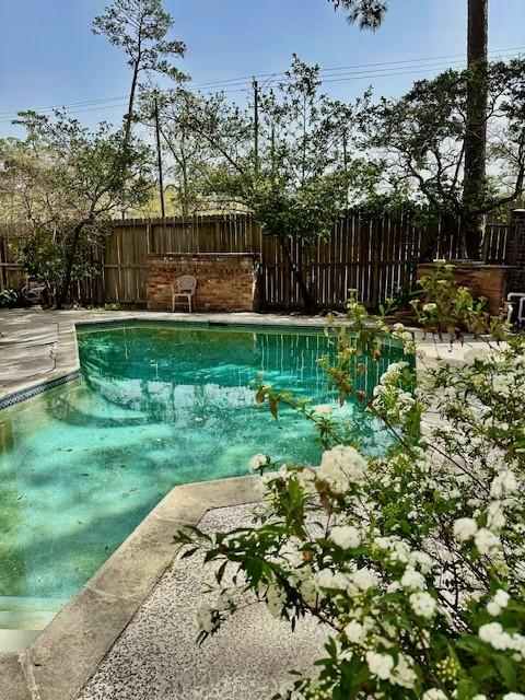 view of pool with fence and a fenced in pool