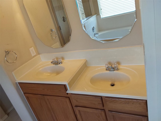 bathroom featuring double vanity and a sink