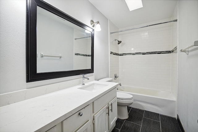 bathroom with shower / washtub combination, toilet, and vanity