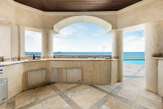 2220 Todville Rd, Seabrook, TX 77586 - view of patio / terrace with area for grilling, a sink, and a water view