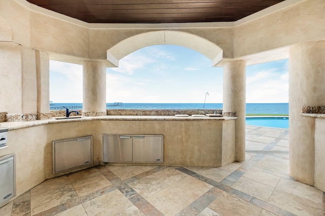2220 Todville Rd, Seabrook, TX 77586 - view of patio / terrace with area for grilling, a water view, and a sink