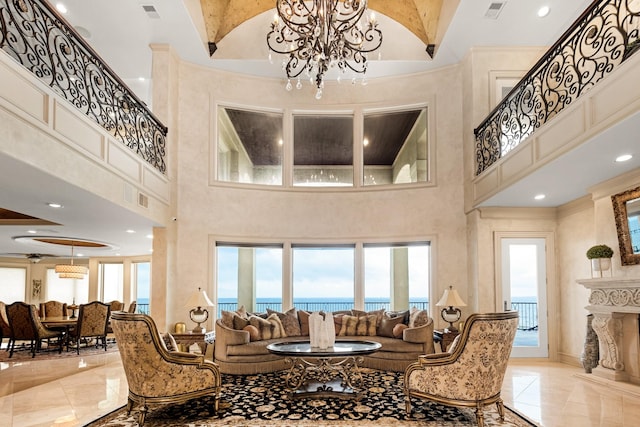 2220 Todville Rd, Seabrook, TX 77586 - common area with a high ceiling, a water view, and stairway