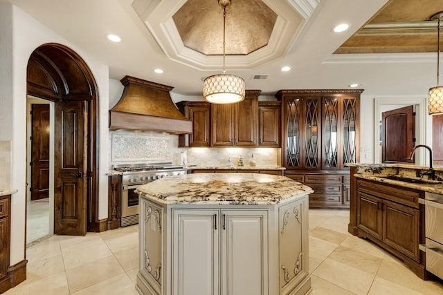 2220 Todville Rd, Seabrook, TX 77586 - kitchen with stainless steel range, a sink, a center island, crown molding, and custom exhaust hood