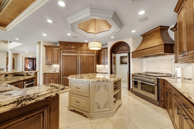 2220 Todville Rd, Seabrook, TX 77586 - kitchen with range with two ovens, custom range hood, a raised ceiling, tasteful backsplash, and ornamental molding