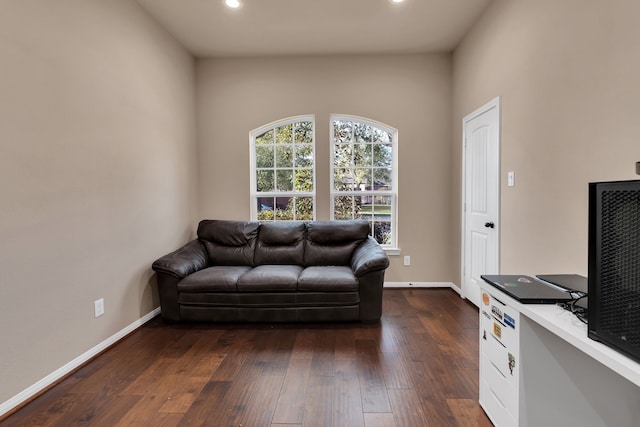 living room with dark wood finished floors, recessed lighting, and baseboards